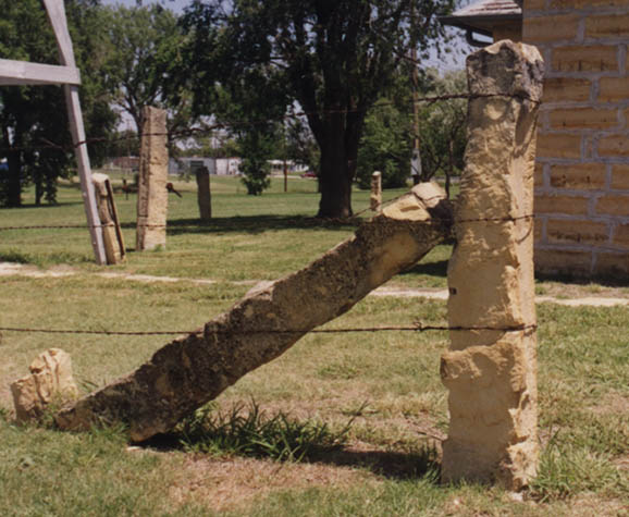 Limestone Post with Brace